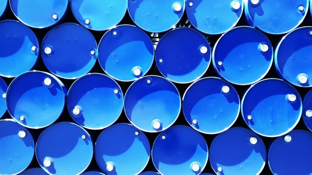 Top view of stacked blue industrial drums forming a geometric pattern.